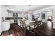 Well-lit kitchen featuring a large center island with seating, stainless steel appliances, and an open layout at 3016 Levinshire Way, Dacula, GA 30019