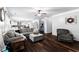 Open living room showcasing seamless transition to the kitchen and dining areas at 3016 Levinshire Way, Dacula, GA 30019