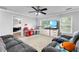 Cozy living room with comfortable seating, carpet floors, a ceiling fan, and large windows at 3016 Levinshire Way, Dacula, GA 30019