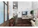 Inviting living room featuring dark wood floors, soaring ceilings, and an open floor plan at 3016 Levinshire Way, Dacula, GA 30019
