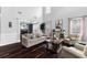 Bright living room with high ceilings, hardwood floors, and views into the dining room at 3016 Levinshire Way, Dacula, GA 30019