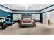 Spacious main bedroom with a tray ceiling, large windows, and plush carpeting at 3016 Levinshire Way, Dacula, GA 30019