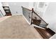 A view of the staircase landing shows the wood treads and carpeted floor at 3016 Levinshire Way, Dacula, GA 30019