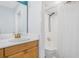 Well-lit bathroom featuring a sink vanity, a shower with a curtain, and a white toilet at 1150 Collier Nw Rd # 25D, Atlanta, GA 30318