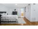 Bright bedroom featuring hardwood floors, a serene atmosphere and ensuite access at 1150 Collier Nw Rd # 25D, Atlanta, GA 30318