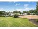 Well-maintained community featuring lush landscaping, a sparkling pool, and a sand volleyball court at 1150 Collier Nw Rd # 25D, Atlanta, GA 30318