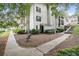 Exterior view of the condo building surrounded by lush landscaping, creating a serene setting at 1150 Collier Nw Rd # 25D, Atlanta, GA 30318