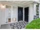 Inviting entryway with a stylish rug and natural light streaming through the adjacent window at 1150 Collier Nw Rd # 25D, Atlanta, GA 30318