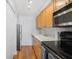 Bright kitchen with stainless steel appliances, white countertops, and ample cabinet space at 1150 Collier Nw Rd # 25D, Atlanta, GA 30318