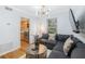 Inviting living room featuring a stylish sectional sofa, modern lighting, and hardwood floors at 1150 Collier Nw Rd # 25D, Atlanta, GA 30318