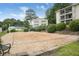 Community sand volleyball court surrounded by mature trees and well-maintained landscaping at 1150 Collier Nw Rd # 25D, Atlanta, GA 30318