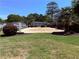 Sand volleyball court surrounded by green lawns, providing a recreational space for residents at 1150 Collier Nw Rd # 25D, Atlanta, GA 30318