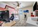 This bedroom features a unique bunk bed, a ceiling fan, a window and light-colored walls at 2102 Braswell Ln, Loganville, GA 30052