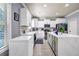 Bright kitchen with white cabinetry, stainless steel appliances, and center island at 2102 Braswell Ln, Loganville, GA 30052