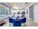 Open-concept kitchen and dining room featuring modern stainless appliances, backsplash, and white cabinets at 2102 Braswell Ln, Loganville, GA 30052