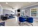 Spacious living room with ample light, modern decor, and a dining area at 2102 Braswell Ln, Loganville, GA 30052