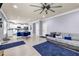 Spacious open concept living and dining area with hardwood floors and comfortable furniture at 2102 Braswell Ln, Loganville, GA 30052