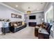 Cozy living room with modern gray walls, stylish decor, and hardwood floors at 2102 Braswell Ln, Loganville, GA 30052