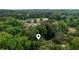 Neighborhood view surrounded by lush trees, signified by a pin location marker at 2804 Dunnington Cir, Chamblee, GA 30341
