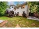Spacious backyard with lush greenery, a patio, and steps leading to an upper area, perfect for outdoor enjoyment at 2804 Dunnington Cir, Chamblee, GA 30341