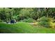 Serene backyard showcasing a fire pit area and lush greenery, creating a peaceful outdoor retreat at 2804 Dunnington Cir, Chamblee, GA 30341