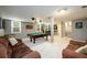 Finished basement with a pool table, seating and neutral color palette at 2804 Dunnington Cir, Chamblee, GA 30341