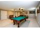 Spacious finished basement featuring a pool table and comfortable seating area at 2804 Dunnington Cir, Chamblee, GA 30341