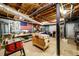 Unfinished basement workshop area with exposed ceiling and utility access at 2804 Dunnington Cir, Chamblee, GA 30341