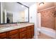 Bathroom features a double vanity, granite counters and tiled shower with tub at 2804 Dunnington Cir, Chamblee, GA 30341