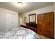 Bedroom with closet, dresser and bed with patterned bedding at 2804 Dunnington Cir, Chamblee, GA 30341