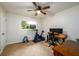 Bright carpeted bedroom with a window view, desk and workout equipment at 2804 Dunnington Cir, Chamblee, GA 30341