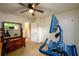 Carpeted bedroom currently used as an exercise room with a desk at 2804 Dunnington Cir, Chamblee, GA 30341