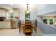 Eat in kitchen area with a round wooden table set next to a well-lit window at 2804 Dunnington Cir, Chamblee, GA 30341