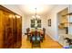 Elegant dining room featuring hardwood floors, a chandelier, and a view into the kitchen, perfect for entertaining at 2804 Dunnington Cir, Chamblee, GA 30341