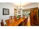 Warm dining room with hardwood floors, a classic wooden table, and views into the living area and kitchen at 2804 Dunnington Cir, Chamblee, GA 30341