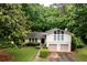 Charming home with a two-car garage, landscaped front yard, and a well-maintained lawn at 2804 Dunnington Cir, Chamblee, GA 30341