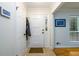 Bright foyer featuring tile flooring, a coat closet, and a view into the living area with hardwood floors at 2804 Dunnington Cir, Chamblee, GA 30341