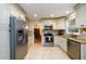 Bright kitchen with stainless steel appliances, granite countertops, and tile backsplash at 2804 Dunnington Cir, Chamblee, GA 30341
