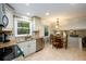 Open concept kitchen with tile floors and granite counters, flowing into dining area at 2804 Dunnington Cir, Chamblee, GA 30341