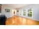 Inviting living room with gleaming hardwood floors and large windows that flood the space with sunlight at 2804 Dunnington Cir, Chamblee, GA 30341