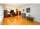 Spacious living area with hardwood floors, a home office setup, and large windows offering plenty of natural light at 2804 Dunnington Cir, Chamblee, GA 30341