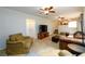 Open living area with a fireplace, carpet, and a staircase leading to the upper level at 2804 Dunnington Cir, Chamblee, GA 30341