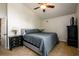 Comfortable main bedroom featuring a ceiling fan, carpet and coordinated furniture at 2804 Dunnington Cir, Chamblee, GA 30341