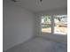 Bright bedroom with large windows offering a view of the neighborhood, awaiting personalization and decor at 452 Maypop Ln, Woodstock, GA 30188