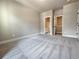 Spacious bedroom with neutral carpeting, access to closet and bathroom. Natural light from the window at 5704 Urban Village Way # 3, Tucker, GA 30084