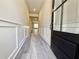 Bright, airy foyer with hardwood flooring, modern wainscoting, and a glass-paneled front door at 5704 Urban Village Way # 3, Tucker, GA 30084
