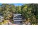 Townhome exteriors and community view with mature trees; parking and a peek of other homes in the neighborhood at 82 Twiggs Cor, Peachtree City, GA 30269