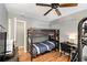 A bedroom with gray walls, a bunk bed, a ceiling fan, and laminate flooring at 82 Twiggs Cor, Peachtree City, GA 30269
