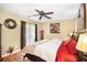 Cozy bedroom with hardwood floors, ceiling fan, and a well-lit ambiance at 82 Twiggs Cor, Peachtree City, GA 30269