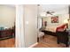 Comfortable bedroom featuring hardwood floors, a ceiling fan, and a closet at 82 Twiggs Cor, Peachtree City, GA 30269